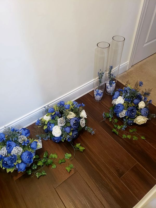Royal blue centerpieces before they meet their vases